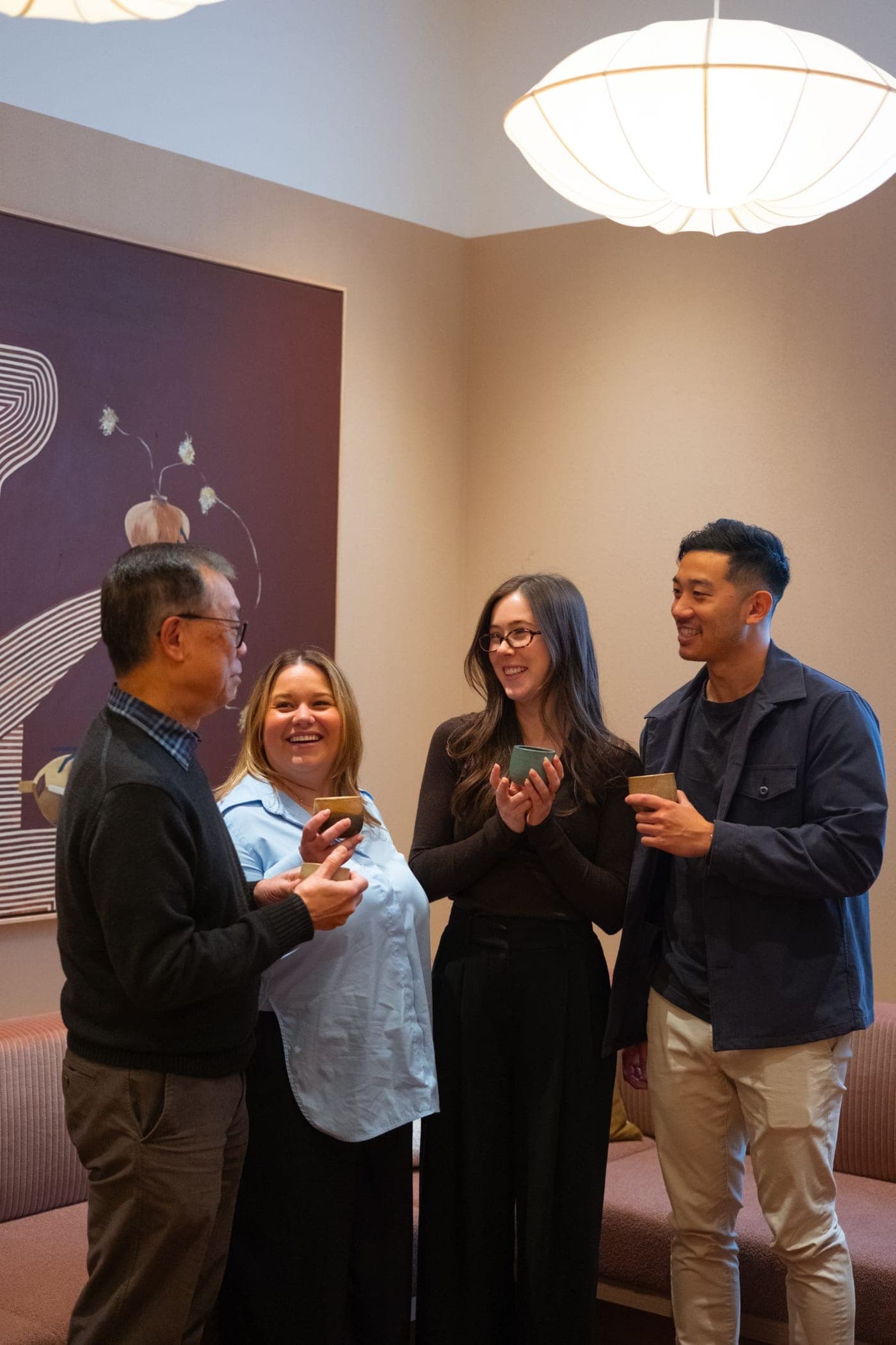 The four Pair co-founders talking together in a warm consulting room